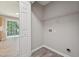 Practical laundry room with laminate flooring, wire shelving, and hookups, conveniently located near the living area at 105 Leacroft Way, Durham, NC 27703