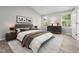 Stylishly furnished main bedroom featuring a comfortable bed and sophisticated decor at 105 Leacroft Way, Durham, NC 27703