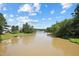 Picturesque water view of a lush green landscape, offering a peaceful and scenic backdrop at 105 Leacroft Way, Durham, NC 27703