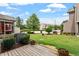 Spacious back yard with a deck and lush green lawn, perfect for outdoor living and entertaining at 107 Tuftin Dr, Durham, NC 27703
