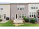 Exterior view of the backyard with deck, lawn, and back door at 107 Tuftin Dr, Durham, NC 27703