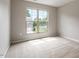 Bright bedroom with a large window overlooking the front yard, providing ample natural light at 107 Tuftin Dr, Durham, NC 27703