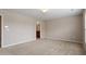 Carpeted bedroom with neutral walls and ensuite bathroom access at 107 Tuftin Dr, Durham, NC 27703