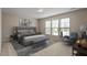 Bright bedroom with a large bed, carpet flooring and lots of natural light at 107 Tuftin Dr, Durham, NC 27703