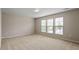 Inviting bedroom featuring carpet flooring and bright windows at 107 Tuftin Dr, Durham, NC 27703