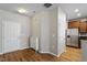 Inviting entryway featuring wood floors, coat closet, and access to the kitchen at 107 Tuftin Dr, Durham, NC 27703