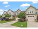 Beautiful townhouse complex with well-maintained lawns, driveways, and lush landscaping at 107 Tuftin Dr, Durham, NC 27703