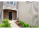 Welcoming front entrance with brick accents, neat landscaping, and a stylish front door at 107 Tuftin Dr, Durham, NC 27703