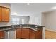Modern kitchen with granite countertops, stainless steel appliances, and ample cabinet space at 107 Tuftin Dr, Durham, NC 27703