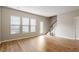 Open living area with hardwood floors, a staircase, and ample natural light at 107 Tuftin Dr, Durham, NC 27703
