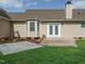 Exterior view of a house featuring a small wooden deck, patio, and well-kept lawn at 110 Westlake Dr, Wendell, NC 27591