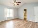 Bedroom featuring a vaulted ceiling, ceiling fan, and wood-look flooring at 110 Westlake Dr, Wendell, NC 27591