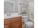 Bathroom featuring a single sink vanity, toilet, tub, and shower combination at 1127 Timbercut Dr, Durham, NC 27703