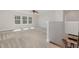 Open bonus room upstairs features neutral walls and carpet, and lots of natural light at 1127 Timbercut Dr, Durham, NC 27703