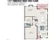 Detailed first-floor layout featuring the living room, kitchen, bedroom, garage, and patio dimensions at 1127 Timbercut Dr, Durham, NC 27703