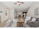 Bright living room showcasing stylish decor, a ceiling fan, and an inviting atmosphere for relaxation and entertainment at 1127 Timbercut Dr, Durham, NC 27703