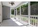 A screened in porch area featuring a ceiling fan and community views at 1127 Timbercut Dr, Durham, NC 27703