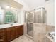 Bright bathroom featuring tile shower, vanity, and soaking tub at 117 Garden Oaks Dr, Smithfield, NC 27577