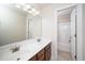A bathroom features double sinks with a large mirror and access to a bathtub/shower at 117 Garden Oaks Dr, Smithfield, NC 27577