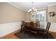 Formal dining room with wood table set with six chairs and natural light at 117 Garden Oaks Dr, Smithfield, NC 27577