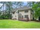 Backyard exterior view of the house with the deck and lawn area at 117 Garden Oaks Dr, Smithfield, NC 27577