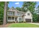 Traditional two-story home with a porch, dormers, and attached garage at 117 Garden Oaks Dr, Smithfield, NC 27577