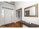 Welcoming foyer with hardwood floors, white door and classic decor at 117 Garden Oaks Dr, Smithfield, NC 27577