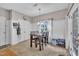 Bright dining area featuring an updated light fixture and a window overlooking the yard at 120 Feezor Ct, Clayton, NC 27527