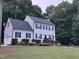Well-maintained home featuring black shutters, a new roof and lush landscaping at 120 Feezor Ct, Clayton, NC 27527