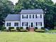 Charming two-story home with lush landscaping and a manicured lawn at 120 Feezor Ct, Clayton, NC 27527