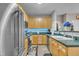 Updated kitchen featuring light wood cabinets, green countertops and stainless steel appliances at 120 Feezor Ct, Clayton, NC 27527