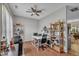 Bright office featuring desk, shelving, hard floors, and ceiling fan at 120 Feezor Ct, Clayton, NC 27527