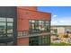 High-rise brick building with a modern balcony and floor-to-ceiling windows offering panoramic city views at 122 N Harrington St # 1555, Raleigh, NC 27603