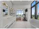 Bright bathroom with dual sinks and floor to ceiling windows at 122 N Harrington St # 1555, Raleigh, NC 27603