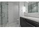 Modern bathroom featuring glass shower, dark cabinetry and marble counter at 122 N Harrington St # 1555, Raleigh, NC 27603