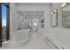 Open bathroom layout with free standing tub and walk in shower at 122 N Harrington St # 1555, Raleigh, NC 27603
