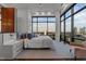 Bedroom with large windows, city views, light-colored walls, and a modern design at 122 N Harrington St # 1555, Raleigh, NC 27603