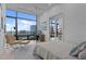 Cozy bedroom with floor to ceiling windows and city views at 122 N Harrington St # 1555, Raleigh, NC 27603