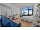 Bright bedroom with a city view, modern decor, and a comfortable space for relaxation and rest at 122 N Harrington St # 1555, Raleigh, NC 27603