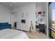 Bright bedroom with a study nook, dresser, and window views at 122 N Harrington St # 1555, Raleigh, NC 27603