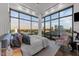 Bright bedroom with city views from expansive windows, showcasing a modern aesthetic and light tones at 122 N Harrington St # 1555, Raleigh, NC 27603