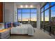 Primary bedroom featuring floor-to-ceiling windows and city views at 122 N Harrington St # 1555, Raleigh, NC 27603