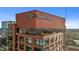 Exterior shot of Quorum Center features brick architecture, signage, and multiple floors with balconies at 122 N Harrington St # 1555, Raleigh, NC 27603