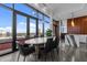 Dining area features modern table, city view, floor-to-ceiling windows and stylish lighting at 122 N Harrington St # 1555, Raleigh, NC 27603