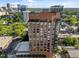Stunning exterior shot of Quorum Center featuring a brick facade and floor-to-ceiling windows against a beautiful skyline backdrop at 122 N Harrington St # 1555, Raleigh, NC 27603