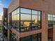 Exterior angle showcasing the large windows reflecting the city skyline at 122 N Harrington St # 1555, Raleigh, NC 27603
