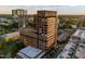Exterior shot of Quorum Center, with lush greenery and city skyline at 122 N Harrington St # 1555, Raleigh, NC 27603
