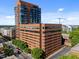 Exterior shot of a multi-story brick building featuring a connected parking garage in a downtown location at 122 N Harrington St # 1555, Raleigh, NC 27603