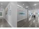 A hallway with decorative artwork and a mirrored wall at 122 N Harrington St # 1555, Raleigh, NC 27603