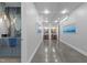 Hallway with decorative artwork and a statement powder room at 122 N Harrington St # 1555, Raleigh, NC 27603